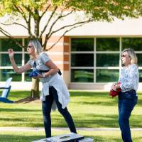 Families playing yard games.